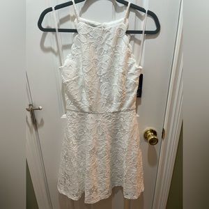 Women’s dress  size 5 BCX NWT, 2 layers, white with a flower pattern.
